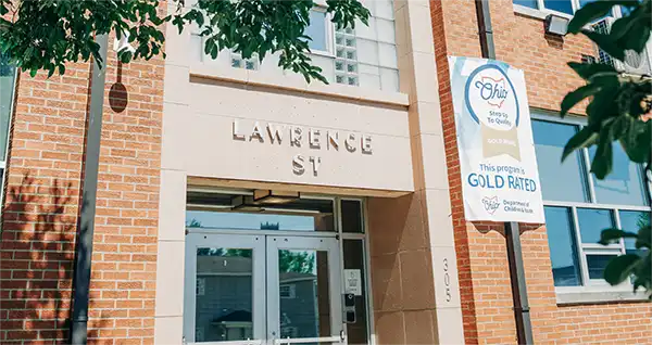 The Lawrence Street entrance of the Ironton Head Start building, with a Gold-rated Step Up to Quality banner.