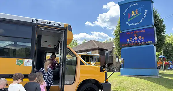 Children boarding a Lawrence County Early Childhood Academy bus.